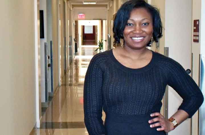 IHUNANYA stands in hallway of Hospital.