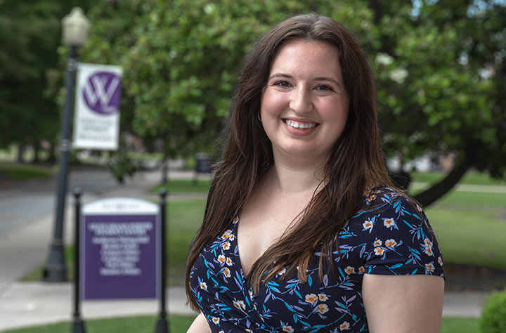 Staff member Laura Feltman smiles for the camera