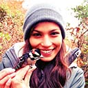 Jasmine Rajbhandary holds bird.