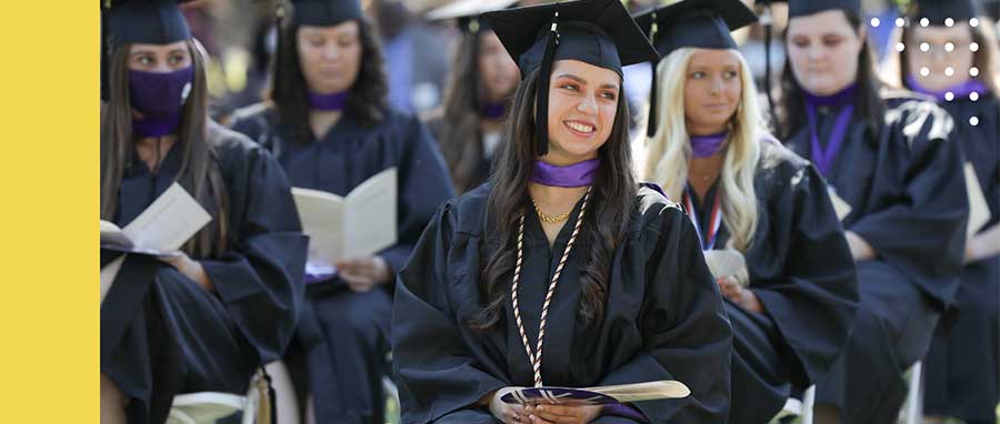 Graduates in gowns.