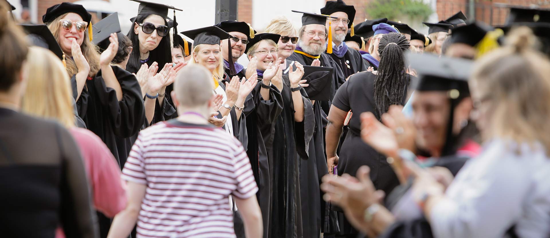 Faculty greeting new students