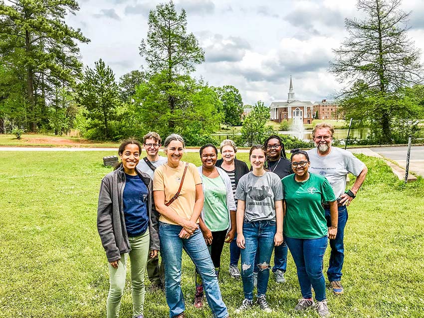 Janisse Ray with students outside.