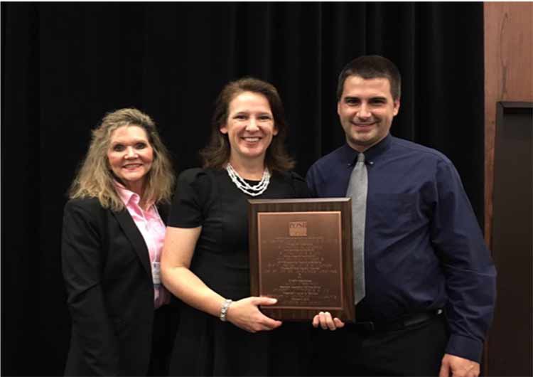 kristen Applebee accepts award.