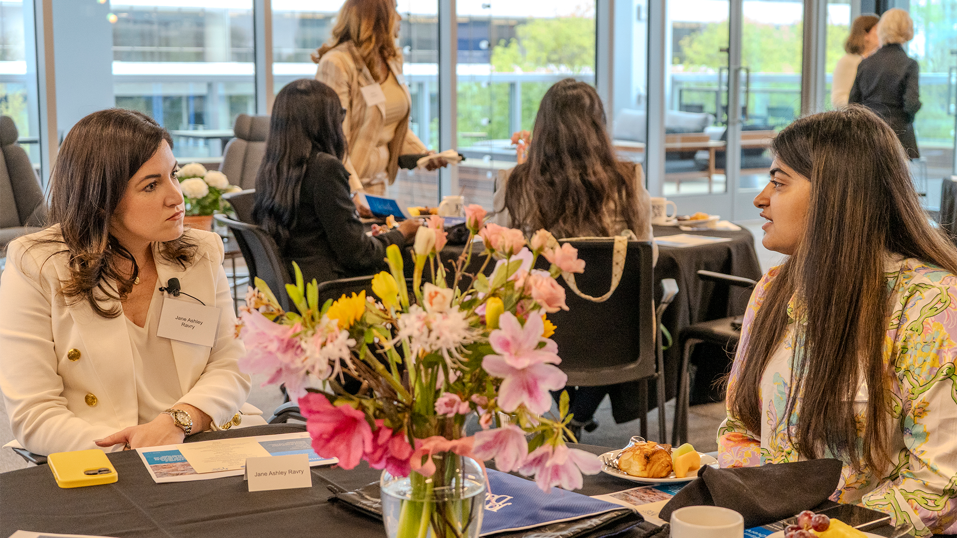CEO Student Speaking to a business women during a meeting